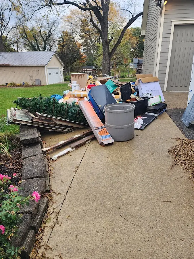Dumpster being loaded with debris for Roofing Dumpster Rental in Fox